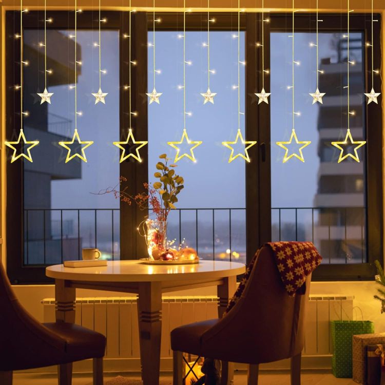 Picture of LED Stars Curtain Lights,12 Stars 138 Window Curtain String Lights with 8 Flashing Modes Decoration for Christmas, Wedding, Party,Wall, Home Decorations,USB/Battery Powered (Warm White)