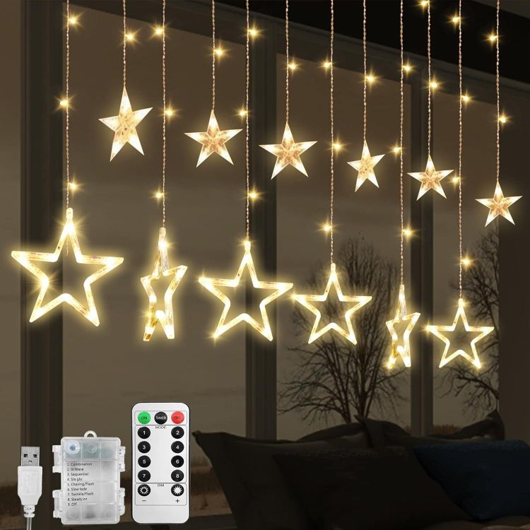 Picture of LED Stars Curtain Lights,12 Stars 138 Window Curtain String Lights with 8 Flashing Modes Decoration for Christmas, Wedding, Party,Wall, Home Decorations,USB/Battery Powered (Warm White)