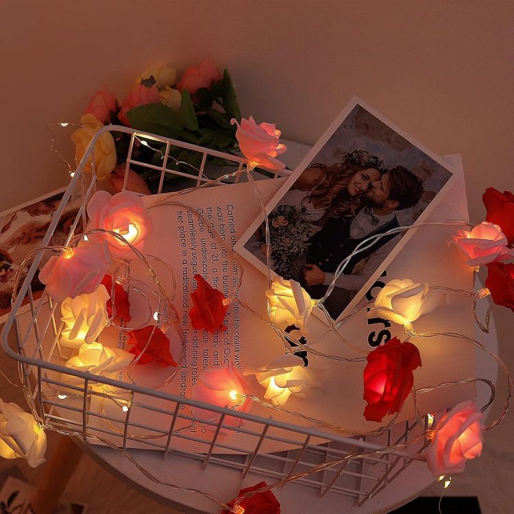 Artificial rose flower LED string lights with warm glow