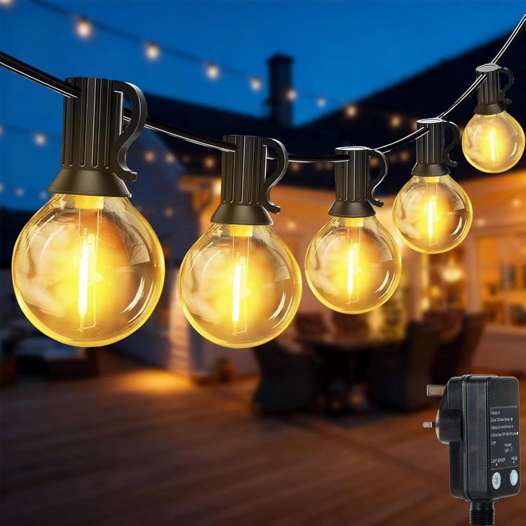 Waterproof outdoor festoon string lights with shatterproof G40 globe bulbs illuminating garden patio