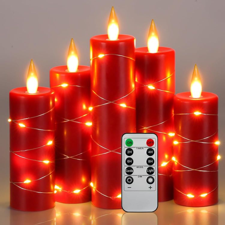 Five graduated height red wax flameless LED candles with embedded silver fairy string lights and dancing flames