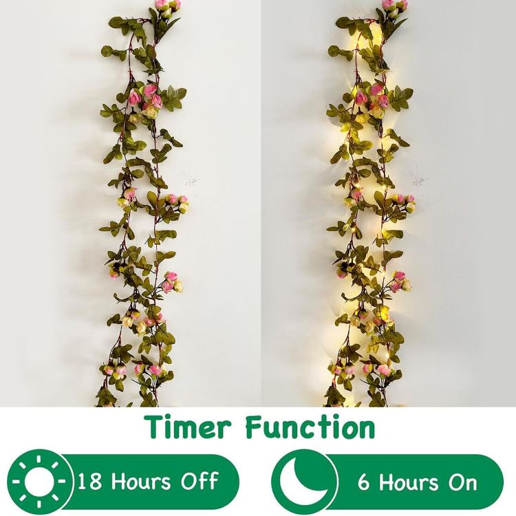 Close-up of flexible copper wire vine with warm white micro LED lights woven through rose garland