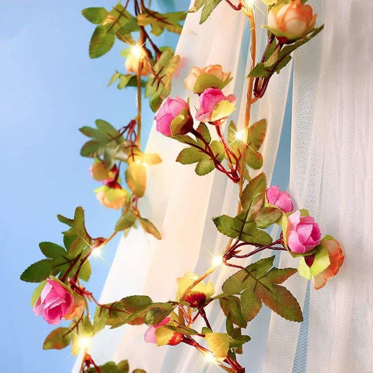 Artificial pink rose bud garland with 20 warm white LED fairy lights on flexible copper wire