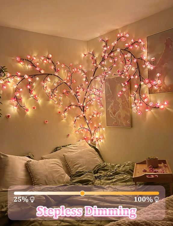 Bedroom wall beautifully decorated with LED cherry blossom branch lights creating romantic ambiance