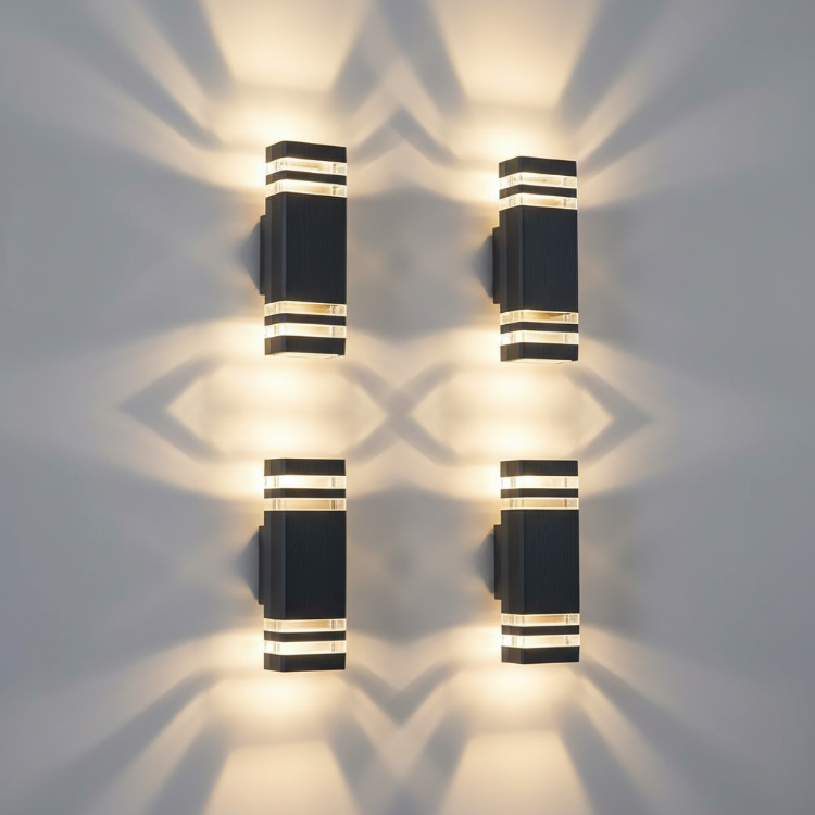 Four exterior wall lights highlighting garden pathways and walls