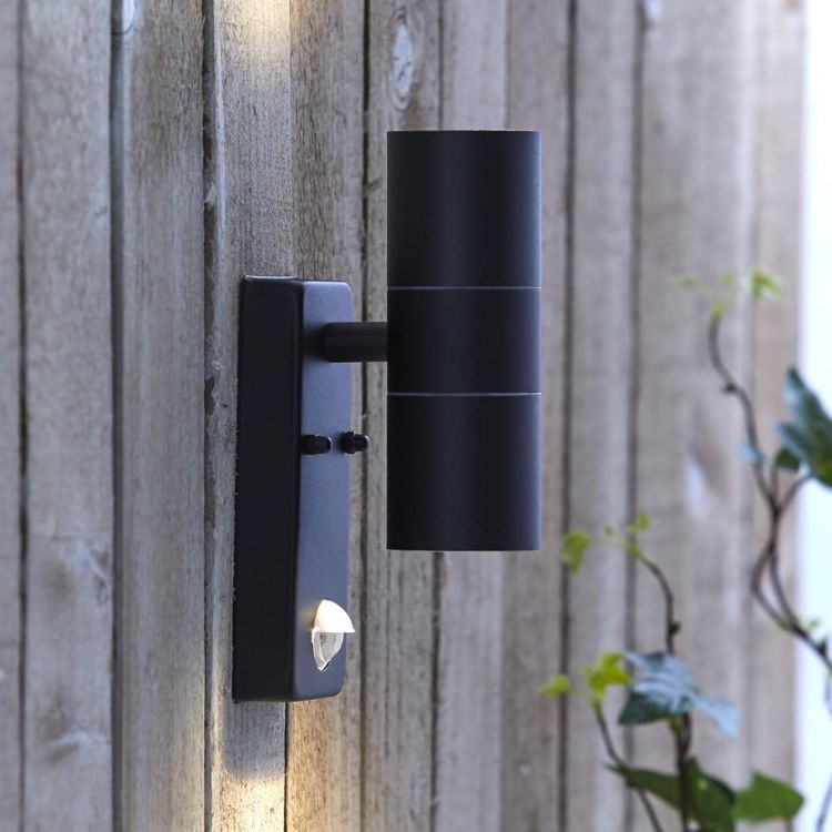 PIR sensor wall lights illuminating entrance and garden