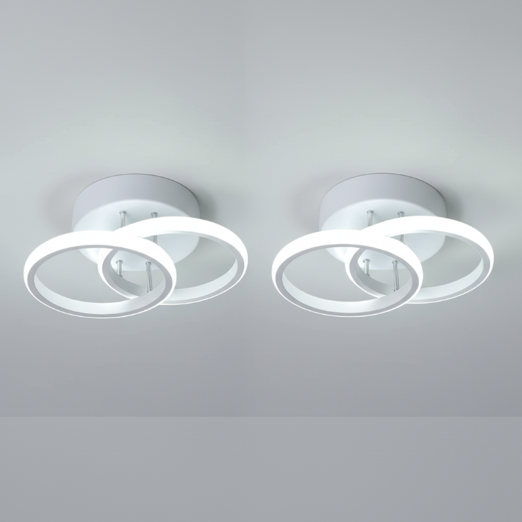 Two white modern creative ceiling lights installed indoors