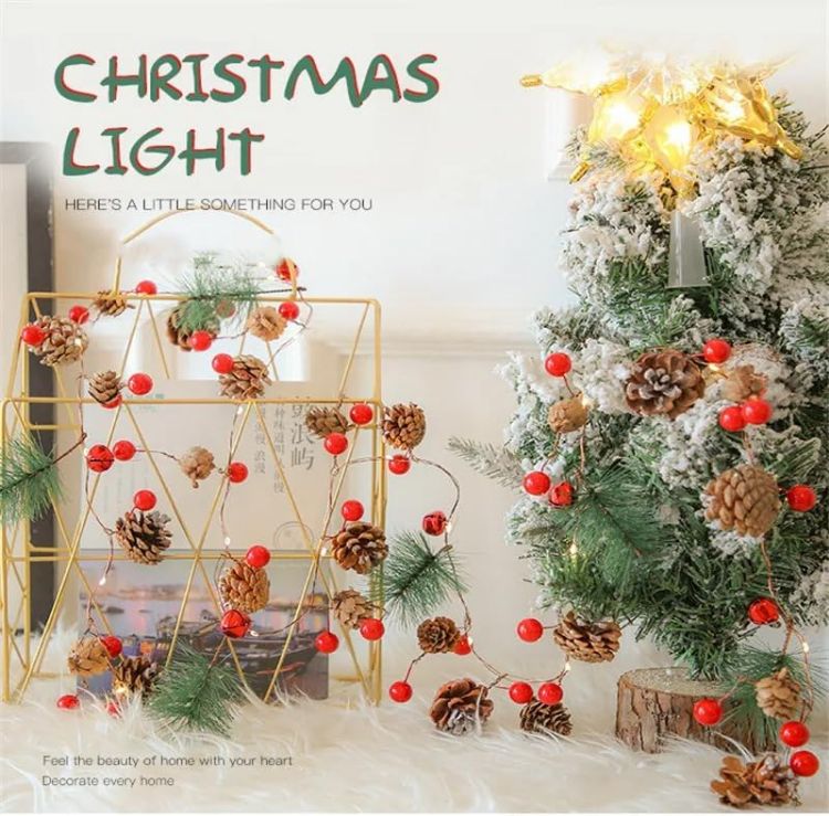 Picture of Christmas Garland 6.6FT Pinecones Christmas String Lights with Red Berries, Bells & Needles, 20 LED Battery Operated Prelit Garland for Christmas Decorations Indoor/Outdoor