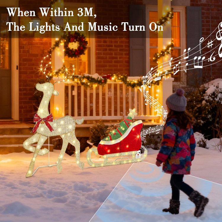 Picture of Outdoor Christmas Decorations, Light up Reindeer Outdoors with Warm White Lights, Motion Sensor Music Xmas Decor, Christmas Sleigh for Lawn Porch Garden