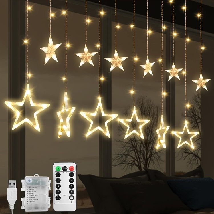 Picture of Christmas LED Stars Curtain Lights,12 Stars 138 Window Curtain String Lights with 8 Flashing Modes Decoration for Wedding, Party,Wall, Home Decorations,USB/Battery Powered (Warm White)