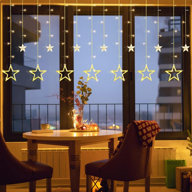 Picture of Christmas LED Stars Curtain Lights,12 Stars 138 Window Curtain String Lights with 8 Flashing Modes Decoration for Wedding, Party,Wall, Home Decorations,USB/Battery Powered (Warm White)