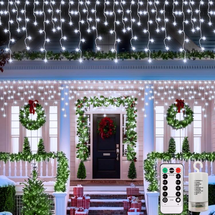 Picture of Outdoor Christmas Lights 6M 300 LED with Remote Timer  8 Modes Icicle Fairy Lights Battery Operated Curtain String Lights for Window Gazebo Balcony Eaves Decor (Cool White)