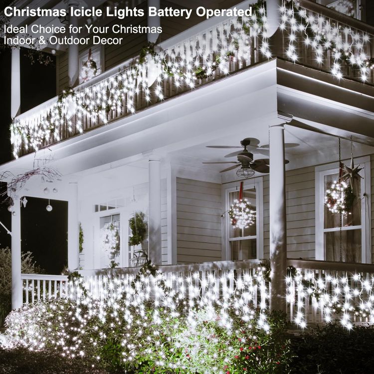 Picture of Outdoor Christmas Lights 6M 300 LED with Remote Timer  8 Modes Icicle Fairy Lights Battery Operated Curtain String Lights for Window Gazebo Balcony Eaves Decor (Cool White)